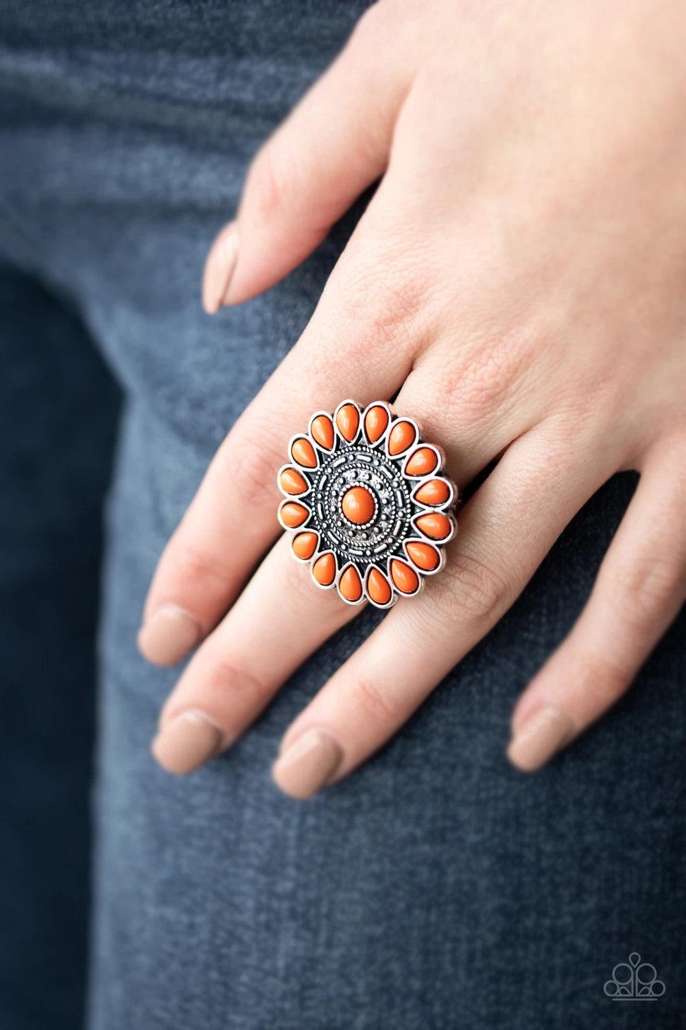 Paparazzi Accessories Posy Paradise - Orange A collection of orange beaded petals flare out from a textured silver center, creating a whimsical flower atop the finger. Features a stretchy band for a flexible fit. Sold as one individual ring. Jewelry