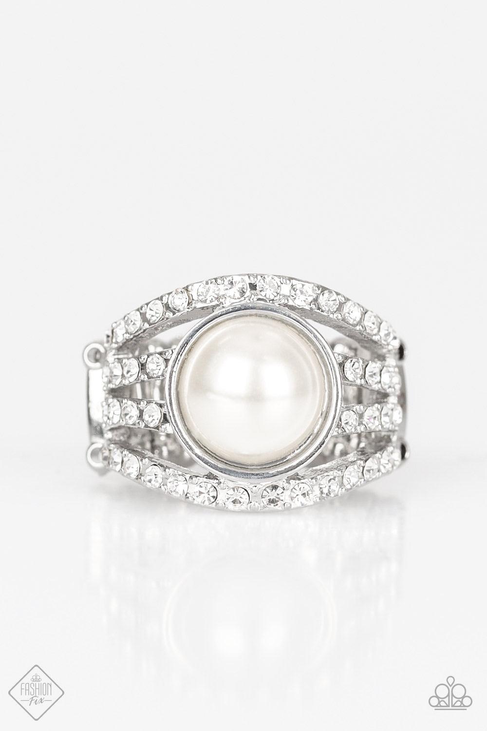 Paparazzi Accessories A Big Break - White Radiating with glassy white rhinestones, row after row of glittering silver bars arc across the finger. A pearly white bead is pressed into the center of the layered bands, adding a dramatically refined finish to