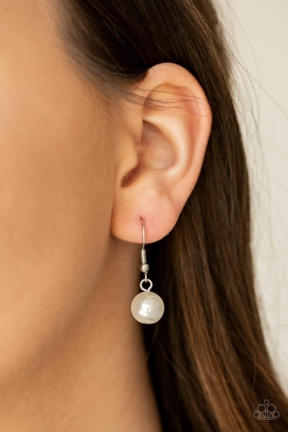 Paparazzi Accessories I Will Fly - Pink A silver bird charm, silver heart charms, and collection of white pearls and opaque pink crystal-like beads swing from the bottom of a lengthened silver chain for a whimsically clustered look. Features an adjustable