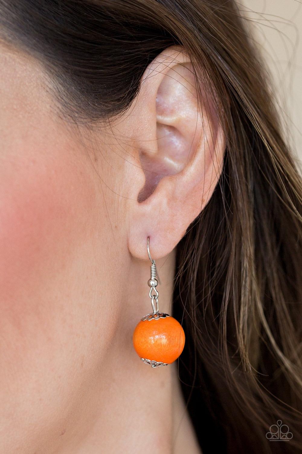 Paparazzi Accessories Caribbean Cover Girl - Orange Brushed in a distressed finish, vivacious orange wooden beads and discs join below the collar for a summery look. Features a button loop closure. Jewelry