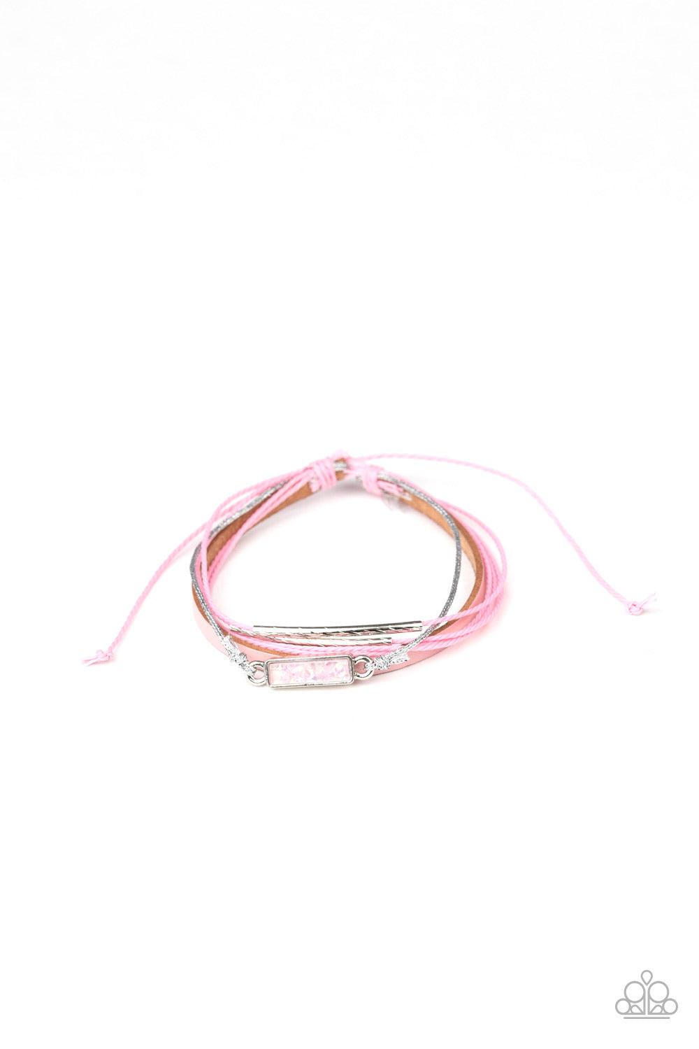 Paparazzi Accessories Interstellar Iridescence - Pink Featuring dainty silver barrel beads and a pink opalescent stone-like frame, a collection of pink leather, and pink and silver cording layers across the wrist for a colorful look. Features an adjustabl