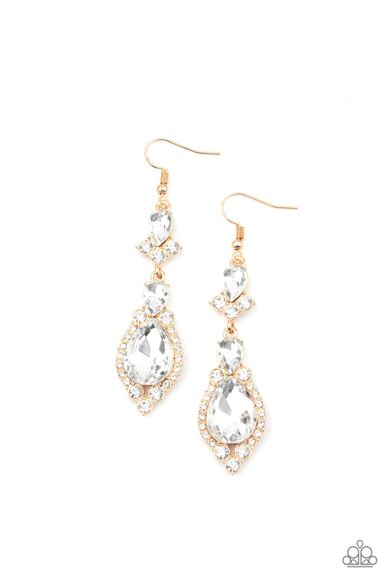Paparazzi Accessories Fully Flauntable - Gold Encased in sleek gold frames, a sparkly series of round and teardrop white rhinestones flawlessly stack into a timelessly twinkly lure for a jaw-dropping look. Earring attaches to a standard fishhook fitting.