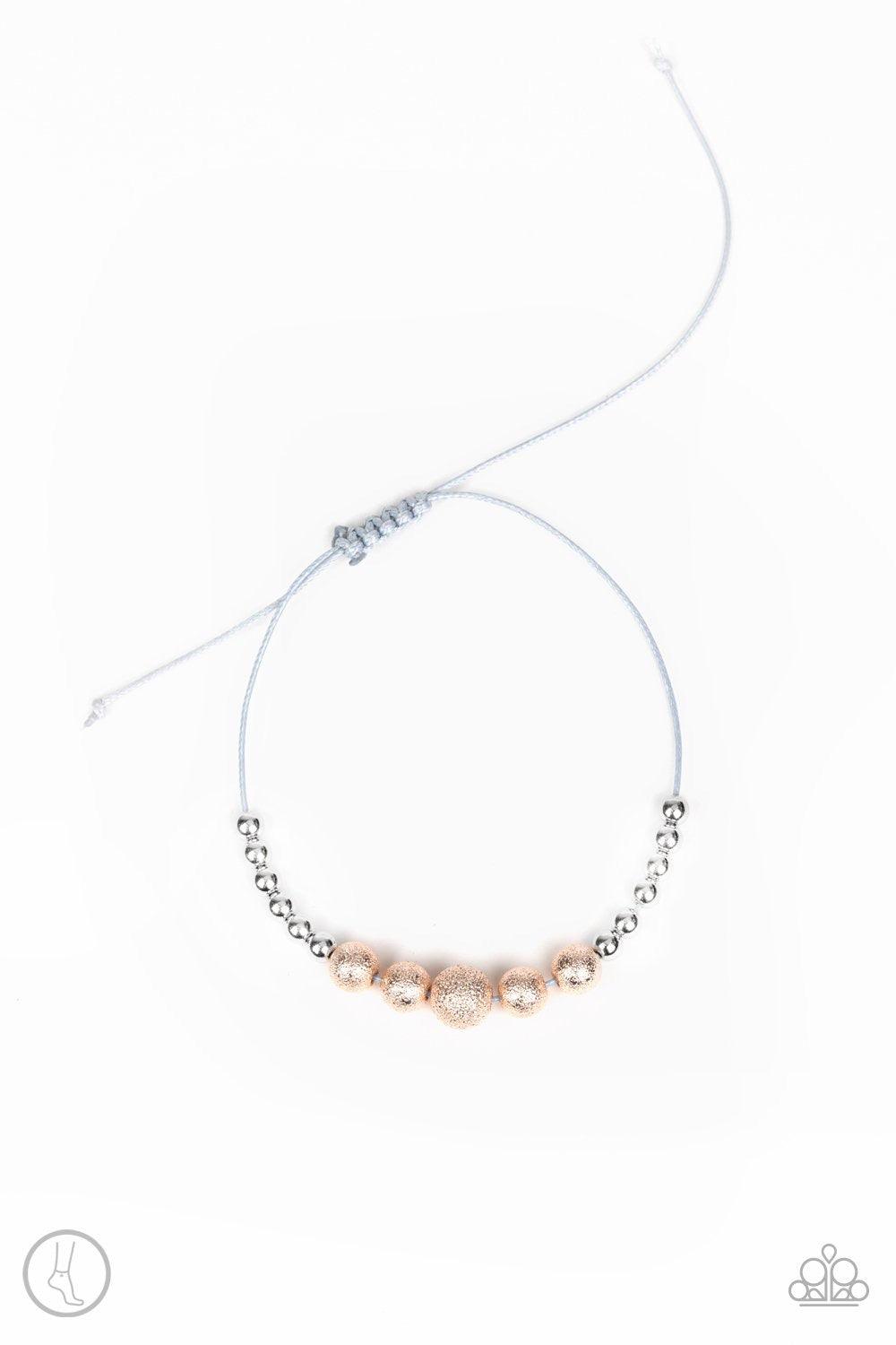 Paparazzi Accessories Beach Zen - Multi A collection of dainty silver and hammered rose gold beads slide along a shiny gray cord around the ankle for a whimsical look. Features an adjustable sliding knot closure. Jewelry