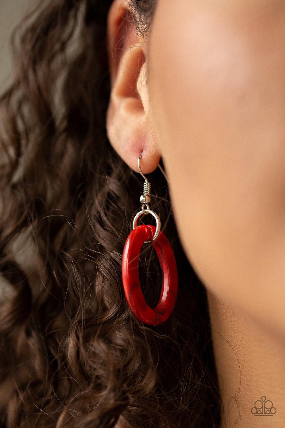Paparazzi Accessories Sizzle Sizzle - Red Suspended from a shimmery silver chain, a collision of round and square red acrylic links connect below the collar in a statement-making fashion. Features an adjustable clasp closure. Jewelry