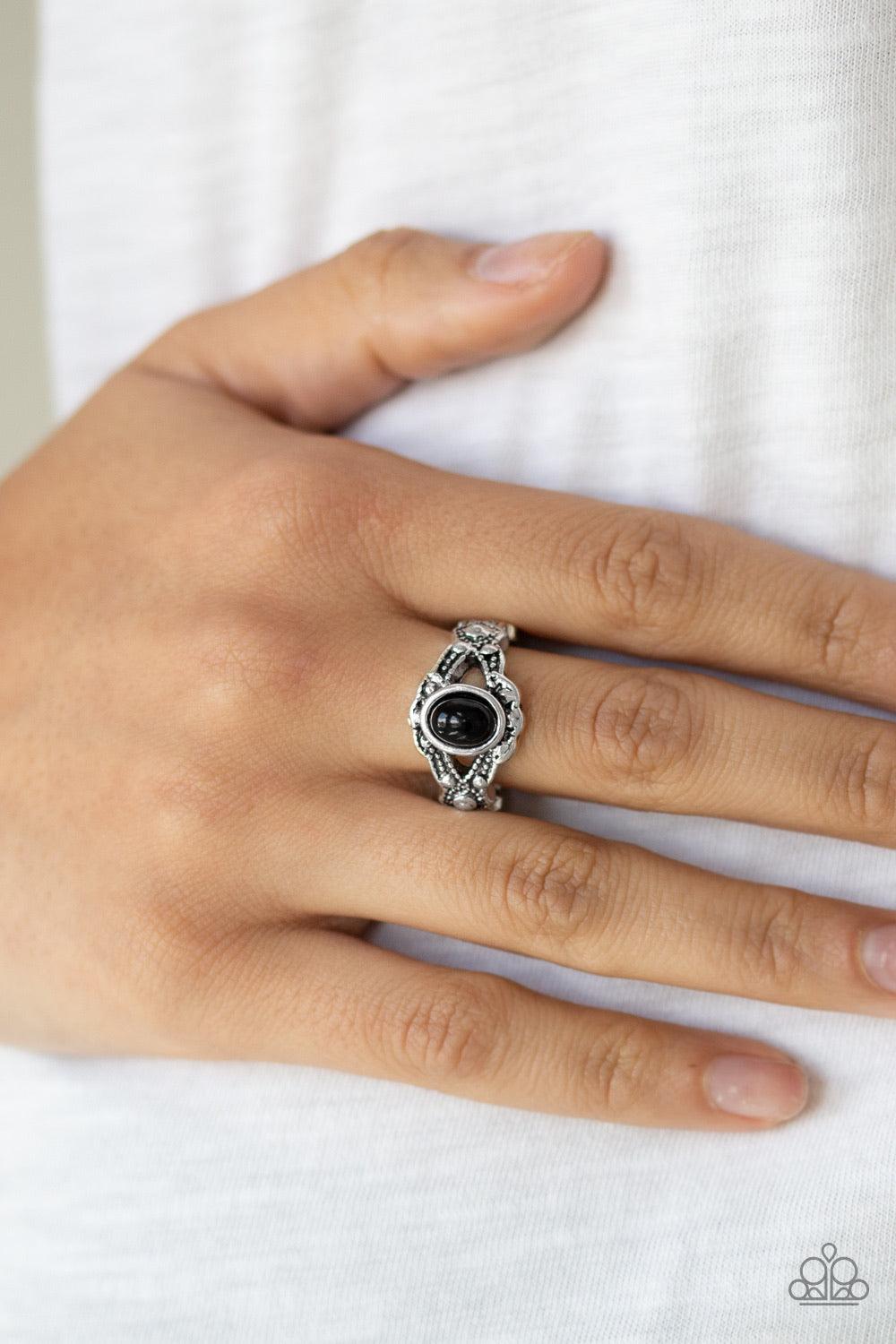 Paparazzi Accessories Definitely DOT! - Black A shiny black bead dots the center of a dainty silver band radiating with studded texture for a whimsical look. Features a dainty stretchy band for a flexible fit. Sold as one individual ring. Jewelry