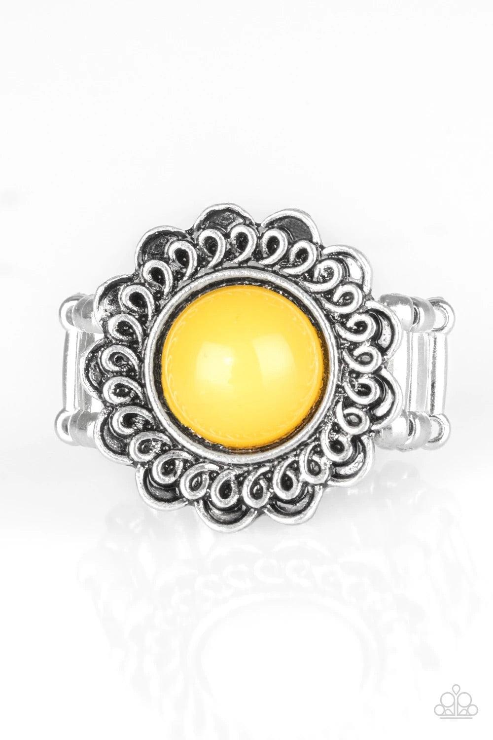 Paparazzi Accessories Garden Stroll - Yellow A sunny yellow bead is pressed into the center of a shimmery floral frame radiating with swirling detail. Features a stretchy band for a flexible fit. Sold as one individual ring. Jewelry