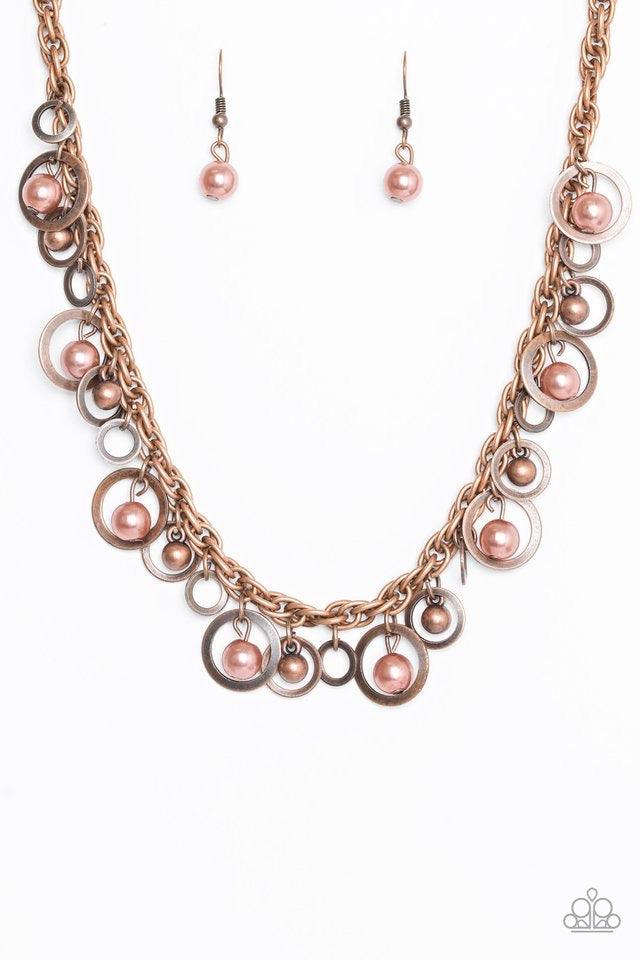 Paparazzi Accessories Shipwreck Style - Copper Brushed in an antiqued shimmer, mismatched copper hoops, copper pearls, and dainty copper beads swing from the bottom of a bold copper chain below the collar for a refined look. Features an adjustable clasp c