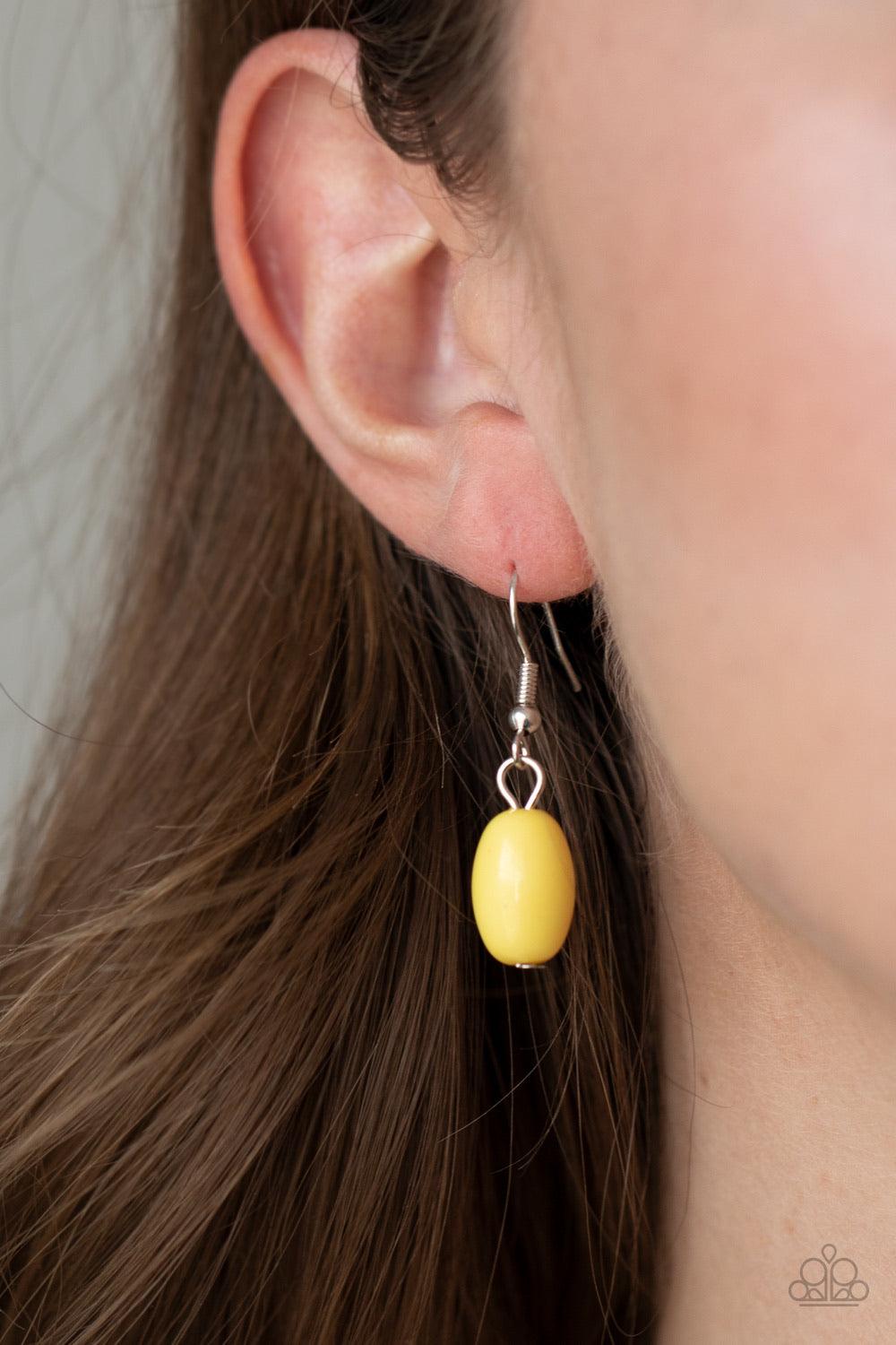 Paparazzi Accessories Flamingo Flamboyance - Yellow Featuring polished and glassy finishes, imperfect yellow and silver beads are threaded along three invisible wires, creating colorful layers below the collar. Features an adjustable clasp closure. Sold a