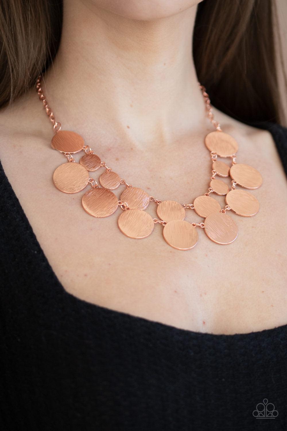 Paparazzi Accessories Stop And Reflect - Copper Featuring a blinding scratched shimmer, a collection of shiny copper discs link below the collar, creating radiant rows. Features an adjustable clasp closure. Sold as one individual necklace. Includes one pa