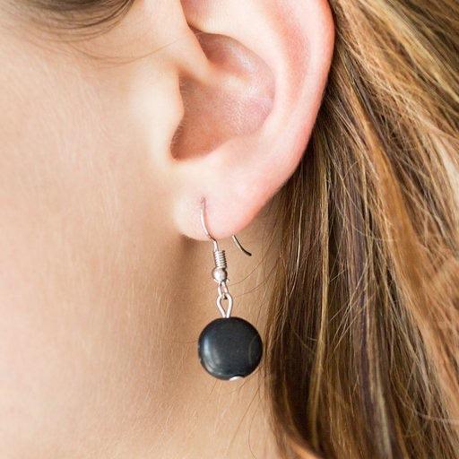 Paparazzi Accessories Canyon Collection ~Black Chiseled into round and earthy pebble cuts, black stones link below the collar in a seasonal fashion. Shiny wooden beads are sprinkled between the earthy stone accents for a handcrafted, artisan inspired fini