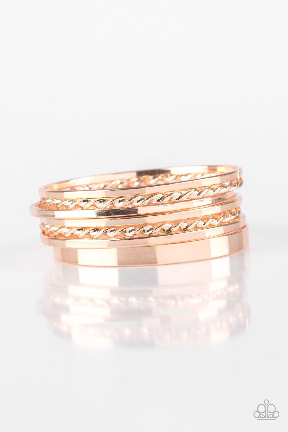 Paparazzi Accessories Basic Blend - Rose Gold Featuring smooth and twisted surfaces, mismatched rose gold bangles stack across the wrist for a casual look. Jewelry