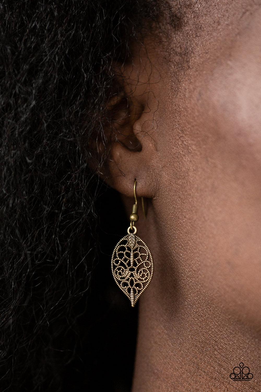 Paparazzi Accessories Leafy Lagoon - Brass Swirling with dotted filigree, dainty brass leaf frames swing from the bottom of a glistening brass chain, creating a whimsical fringe below the collar. Features an adjustable clasp closure. Sold as one individua