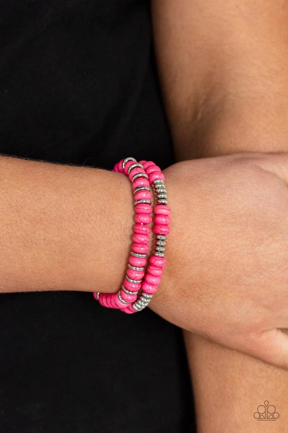 Paparazzi Accessories Desert Rainbow - Pink Dainty silver discs and vivacious pink stone discs are threaded along stretchy bands around the wrist, creating mismatched layers. Bubble gum pink with silver bead accents make this piece fun and flirty. Jewelry