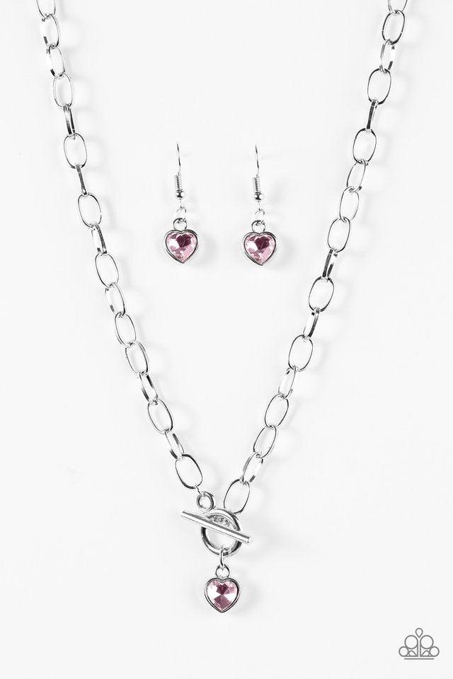 Paparazzi Accessories Let Your Heart Shine - Pink Featuring an elegant lariat centerpiece, a glittery pink gem is pressed into a silver heart frame, creating a timeless pendant below the collar. Features a toggle clasp. Sold as one individual necklace. In