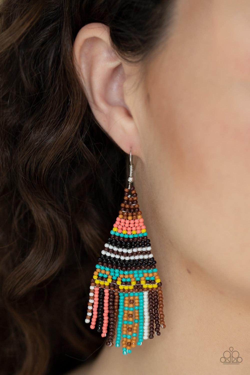 Paparazzi Accessories Beaded Bohemian - Brown A dainty collection of brown, pink, yellow, blue, black, and white seed beads cascade from the ear in a vivaciously beaded fringe. Earring attaches to a standard fishhook fitting. Jewelry