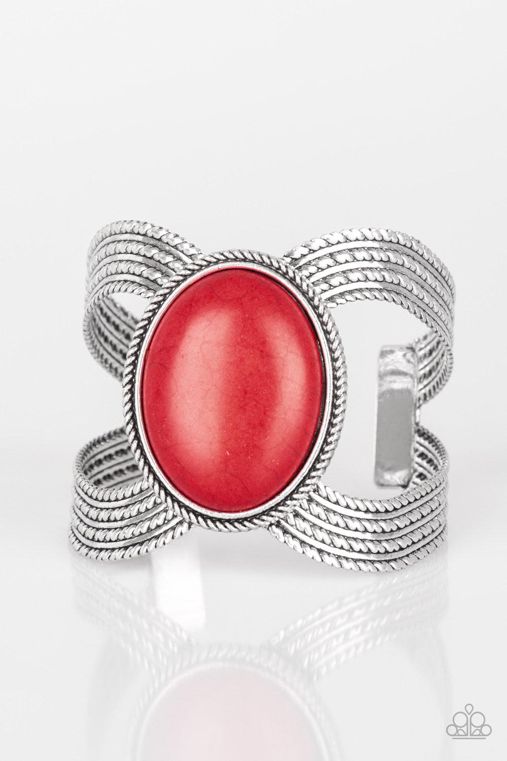 Paparazzi Accessories Coyote Couture - Red A dramatic fiery stone pendant is pressed into the center of textured silver bars, creating a bold seasonal cuff. Jewelry