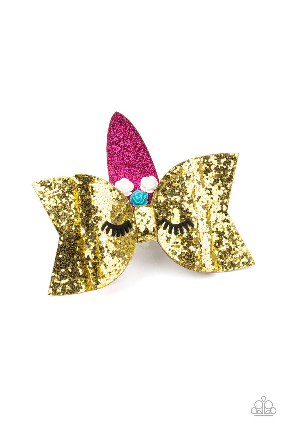 Paparazzi Accessories Just Be YOU-nicorn - Gold Decorated in white and blue resin roses, a sparkling pink horn crowns a glittery gold hair bow featuring suede eyelashes, creating an adorable unicorn. Features a standard hair clip on the back. Sold as one