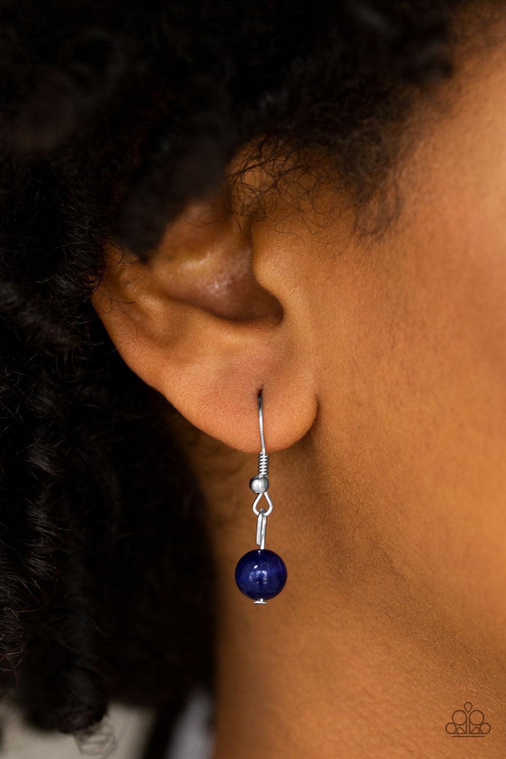 Paparazzi Accessories Friends in Glow Places - Blue Infused with a white rhinestone encrusted fitting, an asymmetrical blue moonstone swings from the bottom of an elongated silver chain for a whimsical look. Features an adjustable clasp closure. Jewelry