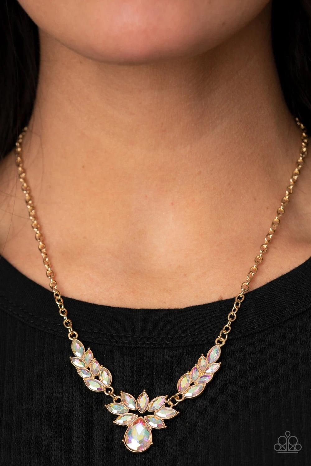 Paparazzi Accessories I Need Some HEIR - Multi Dotted with marquise style metallic iridescent rhinestones, leafy gold frames delicately connect into a vintage inspired pendant below the collar. An oversized metallic iridescent teardrop crowns the golden c
