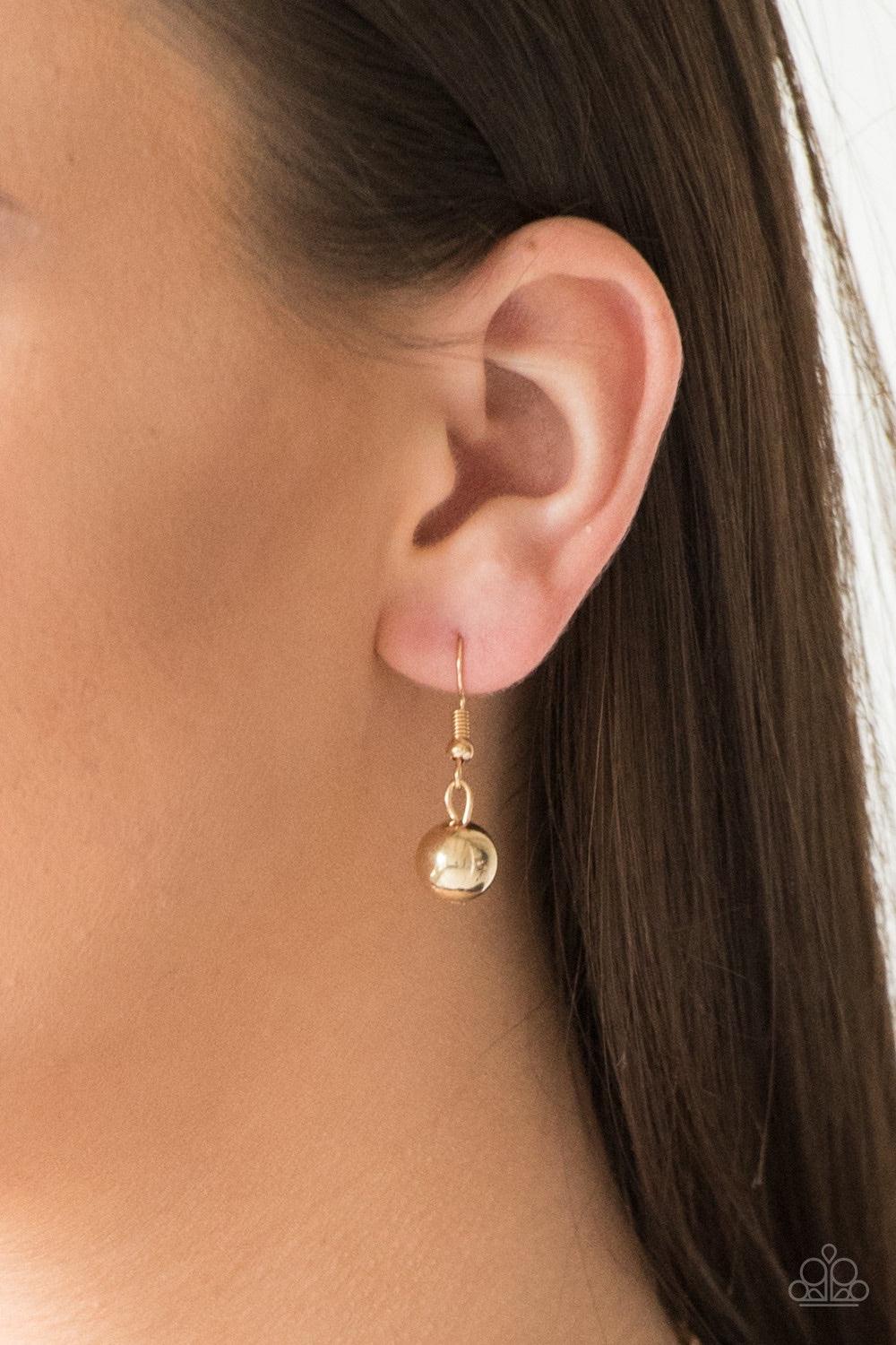 Paparazzi Accessories RITZ It All - Gold Glittery white rhinestones and oversized gold beads give way to layers of mismatched gold chains for a refined look. Features an adjustable clasp closure. Jewelry
