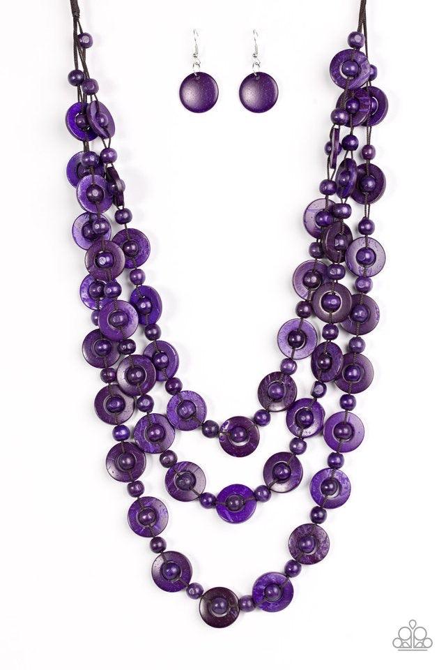 Paparazzi Accessories Bermuda Belle - Purple Brushed in a vivacious purple finish, wooden rings and beads are knotted in place along three strands, creating summery layers down the chest. Features a button loop closure. Jewelry