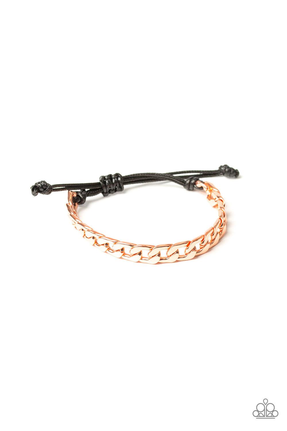 Paparazzi Accessories Score! - Copper Shiny black cording knots around the ends of a thick shiny copper curb chain that is wrapped across the top of the wrist for a versatile look. Features an adjustable sliding knot closure. Jewelry