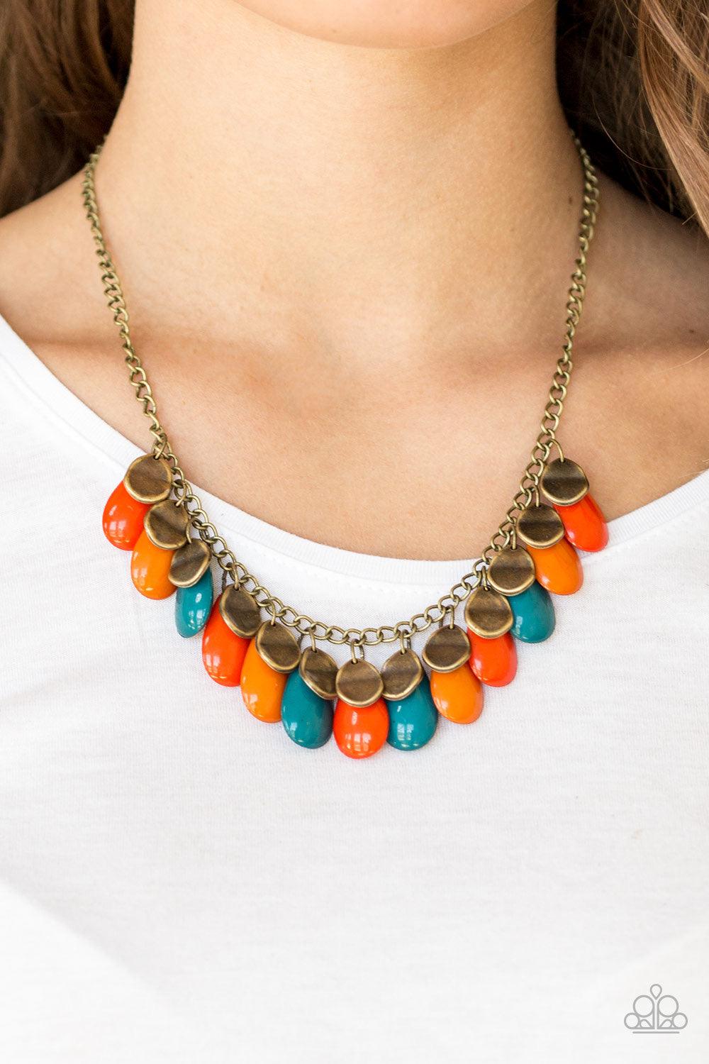 Paparazzi Accessories Tropical Storm ~Multi Polished blue, orange, and red teardrops drip from the bottom of a shimmery brass chain, creating a colorful fringe below the collar. Featuring a delicately hammered surface, dainty brass teardrops are sprinkled