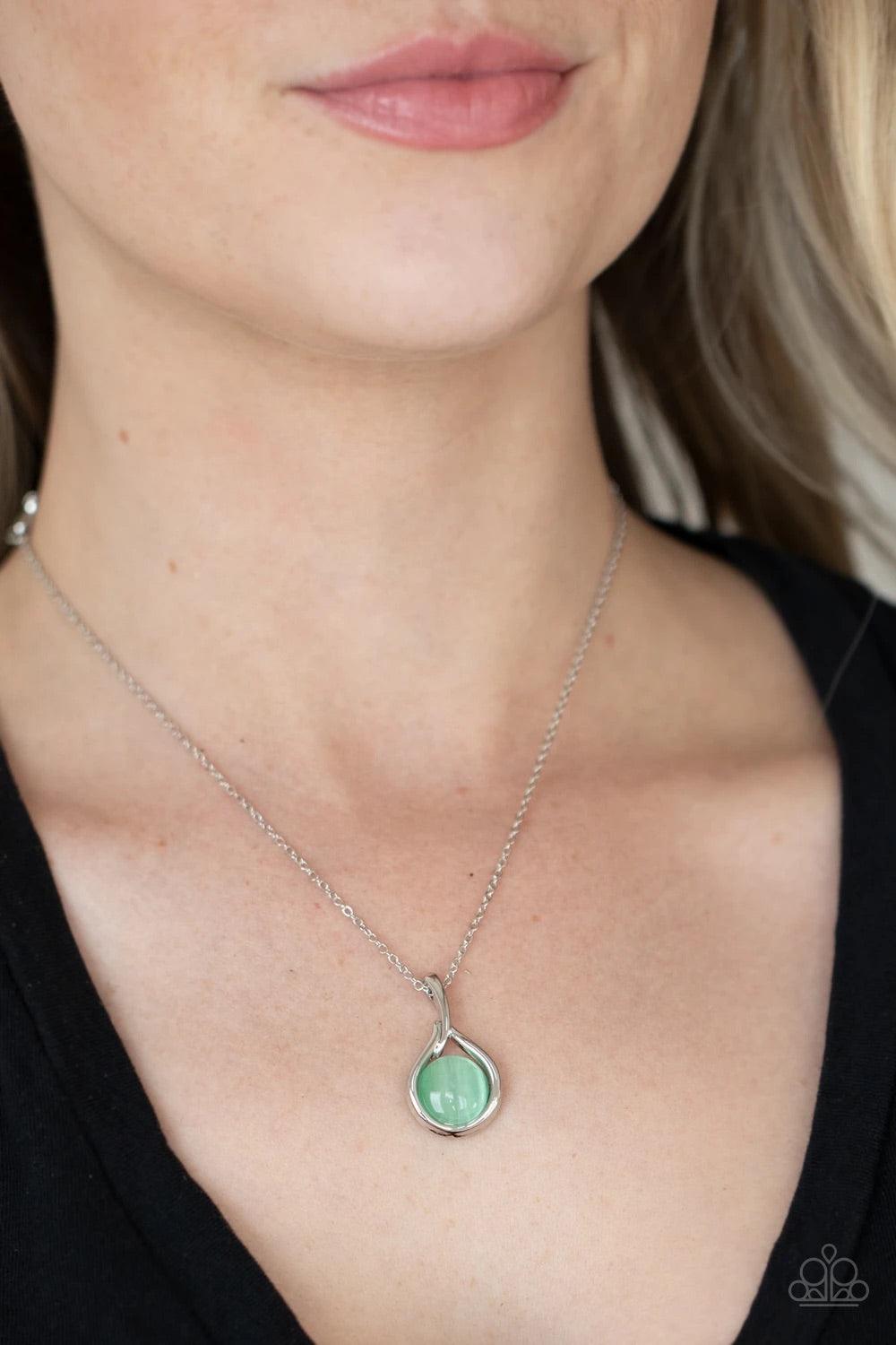 Paparazzi Accessories Fairy Lights - Green A glowing green cat's eye stone is asymmetrically nestled inside a dainty silver fitting, creating an enchanting pendant below the collar. Features an adjustable clasp closure. Sold as one individual necklace. In