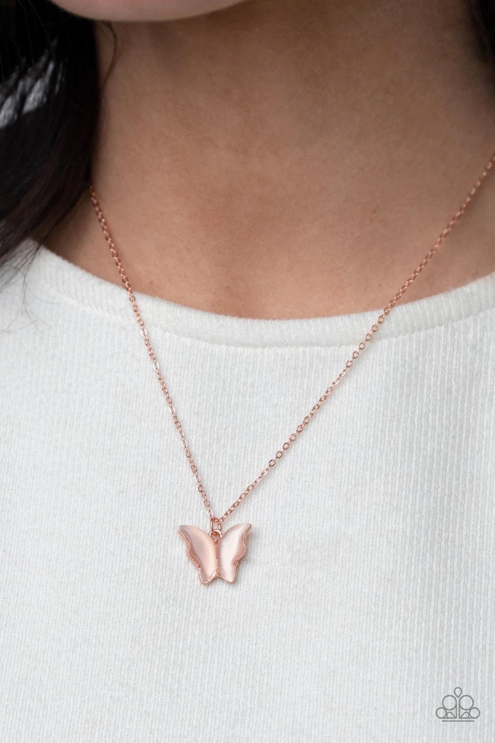 Paparazzi Accessories Butterfly Prairies - Copper Infused with glistening white cat's eye stone wings, a shiny copper butterfly pendant swings from a dainty copper chain below the collar for a whimsy flair. Features an adjustable clasp closure. Sold as on