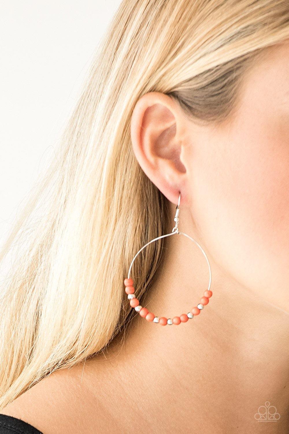 Paparazzi Accessories Stone Spa - Orange Dainty silver beads and refreshing orange stone beads slide along a dainty silver hoop for a seasonal look. Earring attaches to a standard fishhook fitting. Jewelry
