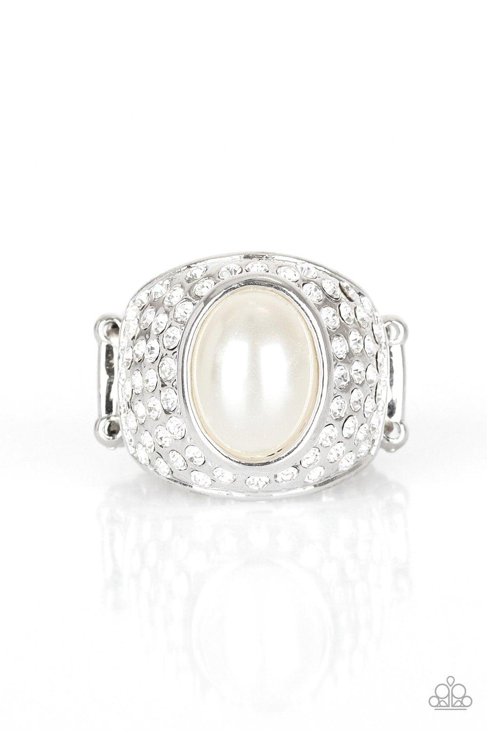 Paparazzi Accessories Glittering Go-Getter - White A pearly white bead is pressed into the center of a bold silver band radiating with countless white rhinestones, creating a dramatic statement piece atop the finger. Features a stretchy band for a flexibl