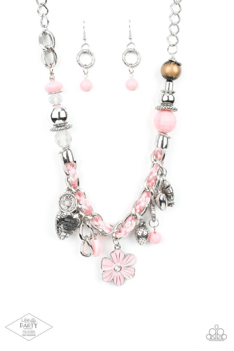 Paparazzi Accessories Charmed, I Am Sure - Pink Pink cording is braided through a chunky silver chain. A unique variety of charms decorate the piece including a delicate flower and a heart inscribed with the phrase "With All My Heart" on one side and a sh