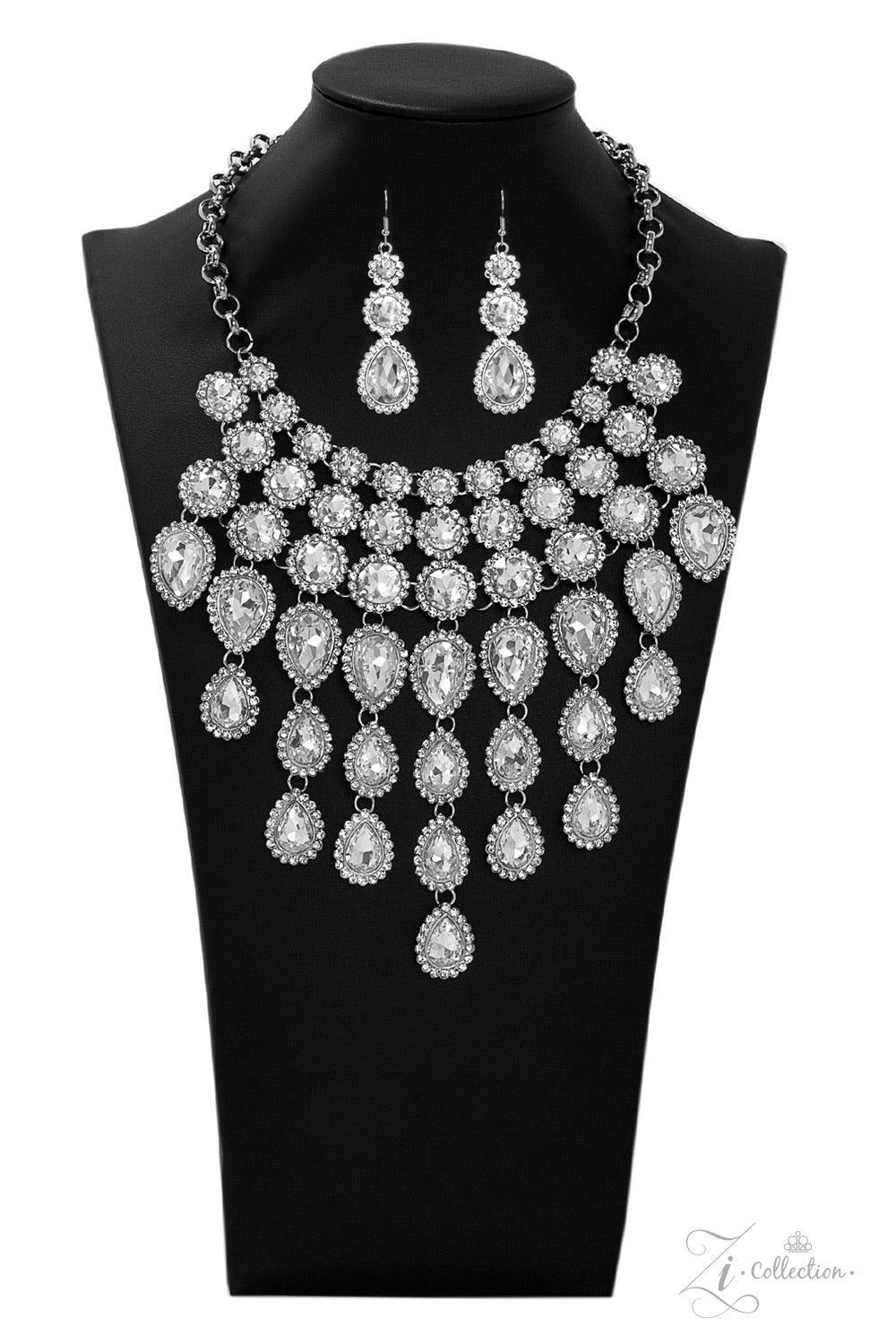 Paparazzi Accessories Mesmerize 💗ZiCollection $25💗 Encrusted in dainty white rhinestone frames, columns of glassy white gem studded frames increase in size as they drip below the collar. Varying in size and number, white rhinestone encrusted teardrop ge