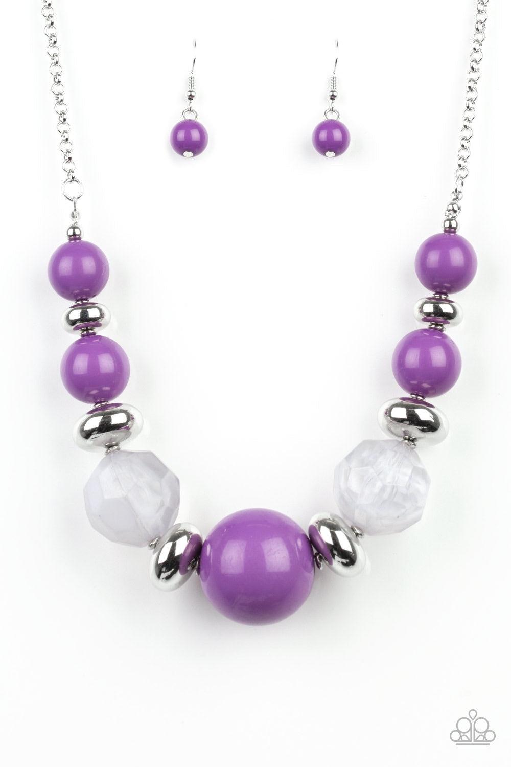 Paparazzi Accessories Daytime Drama - Purple Gradually increasing in size near the center, a collection of purple, silver, and cloudy beads join below the collar in a statement making fashion. Features an adjustable clasp closure. Jewelry