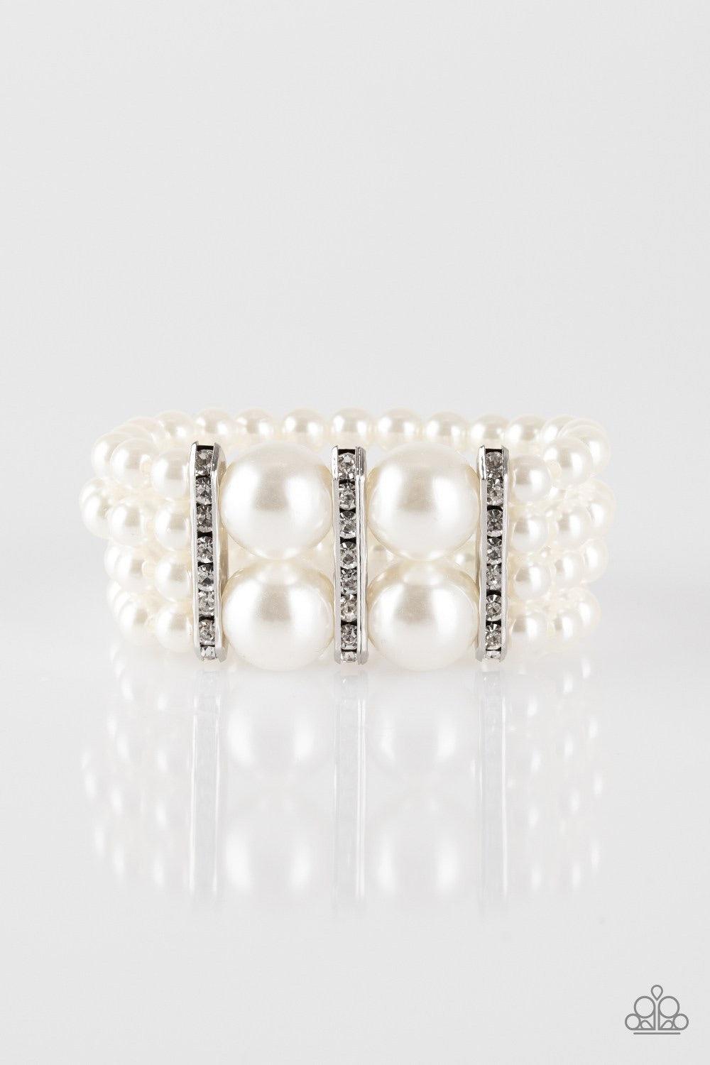 Paparazzi Accessories Romance Remix - White Strands of shiny white beads are threaded along stretchy elastic bands and joined together by white rhinestone encrusted frames. The glittery frames combine with oversized beads at the center, adding a dramatic