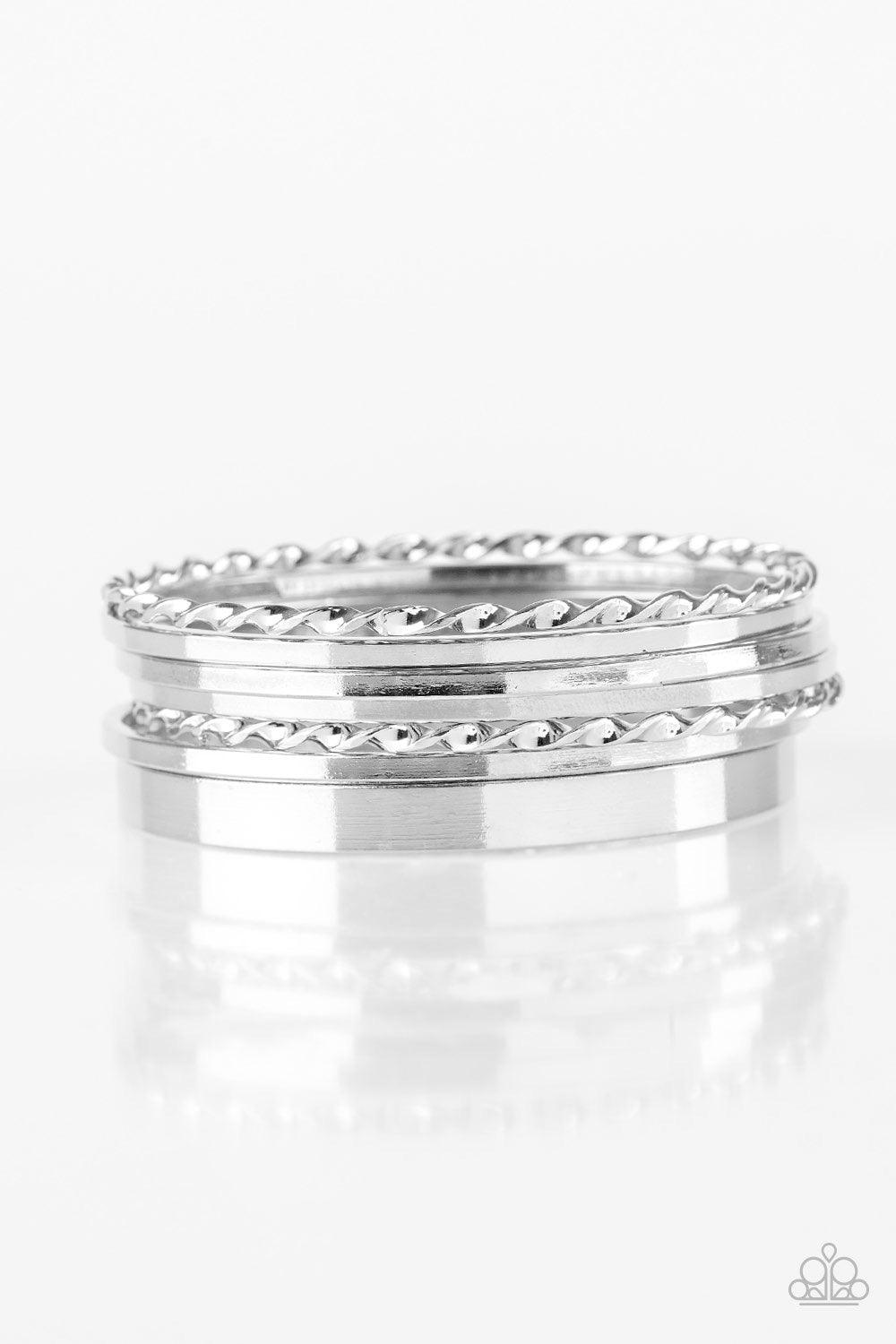 Paparazzi Accessories Basic Blend - Silver Featuring smooth and twisted surfaces, mismatched silver bangles stack across the wrist for a casual look. Jewelry