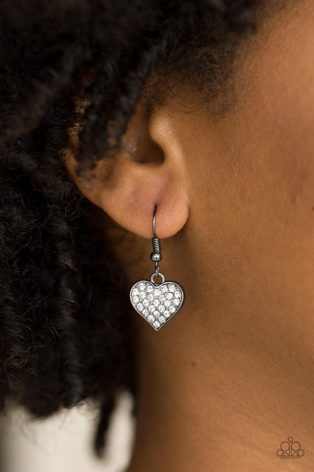 Paparazzi Accessories Harvard Hearts - Black Encrusted in glassy white rhinestones, a dainty gunmetal heart swings from the bottom of a glistening gunmetal chain for a classic look. Features a toggle closure. Jewelry
