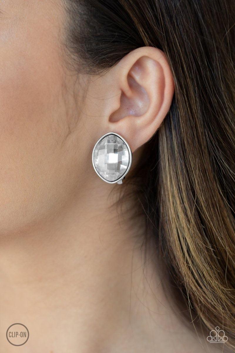 Paparazzi Accessories Movie Star Sparkle - White *Clip-On Featuring a faceted finish, an oversized marquise-shaped gem is nestled in a sleek silver frame for an undeniably statement-making look. Earring attaches to a standard clip-on fitting. Jewelry