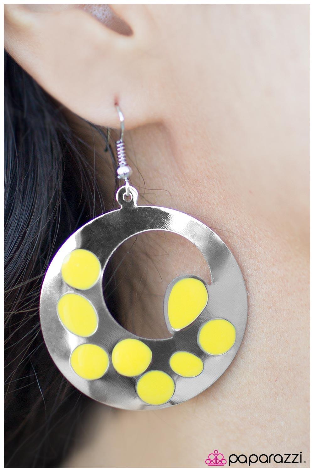 Paparazzi Accessories Pull Yourself Together ~Yellow A sleek silver circle is glazed in a yellow spotted design. Finished in a high-sheen shimmer, the incandescent silver frame and playful splashes of color create a whimsical display. Earring attaches to