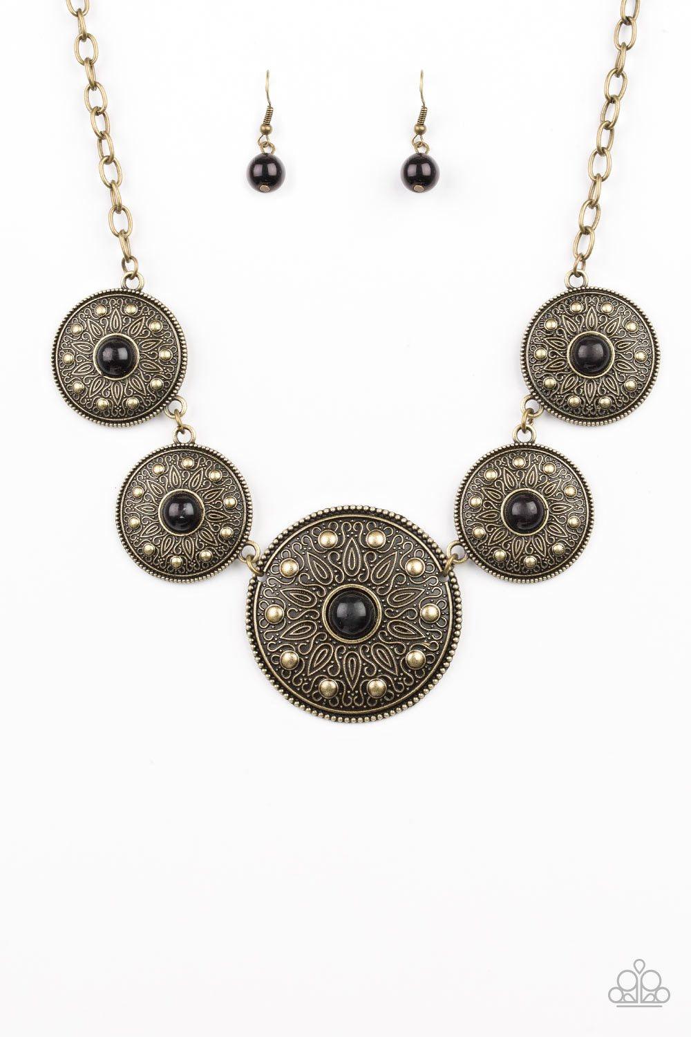 Paparazzi Accessories Hey, SOL Sister - Black Gradually increasing in size near the center, round brass frames radiating with sunburst patterns link below the collar. Infused with shiny brass studs, the tribal inspired frames are dotted with black beaded