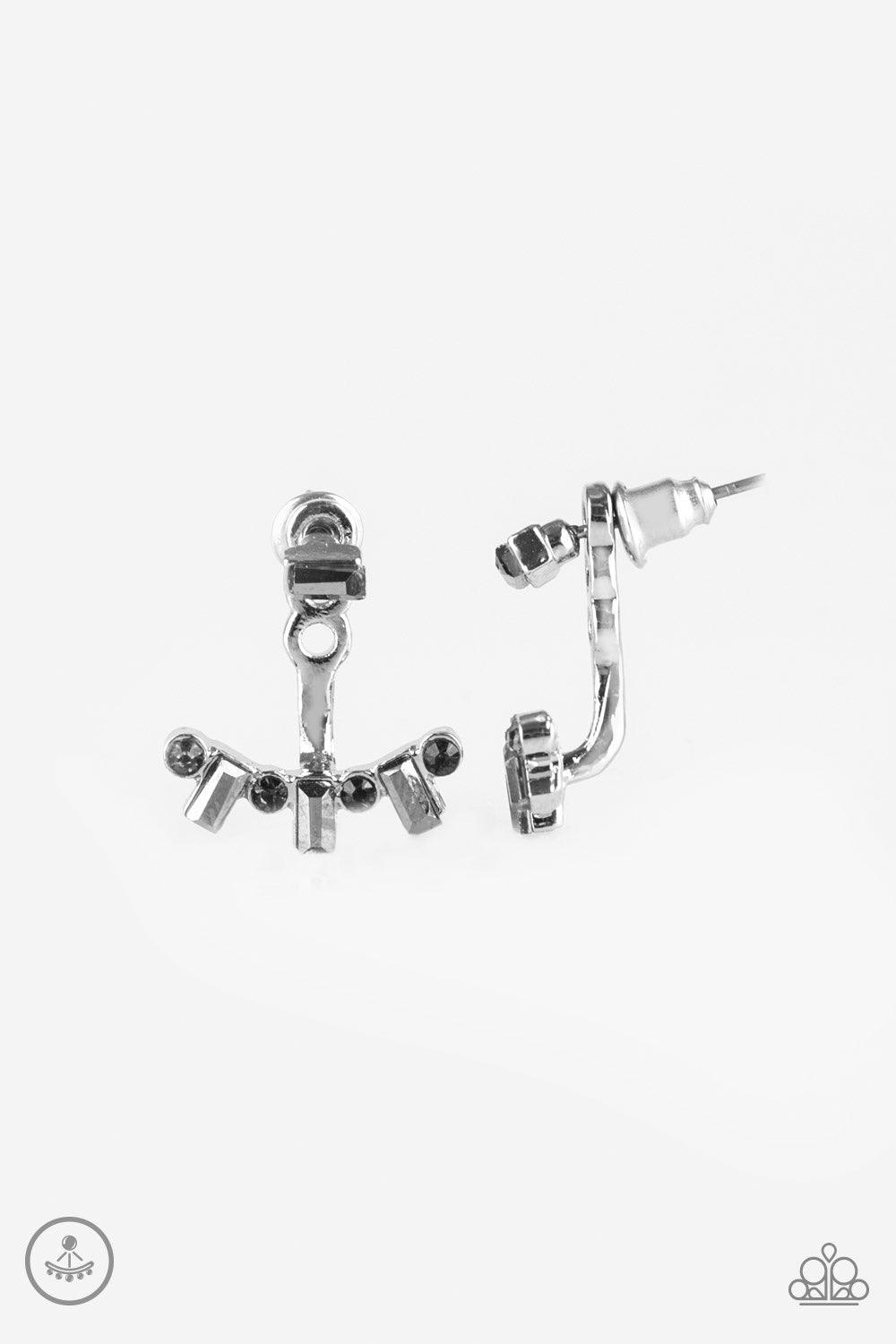 Paparazzi Accessories Courageously Cosmo - Silver A hematite emerald-cut rhinestone attaches to a double-sided post, designed to fasten behind the ear. Brushed in a high-sheen shimmer, the smoky rhinestone encrusted double-sided post peeks out beneath the