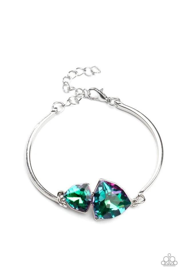 Paparazzi Accessories Deep Space Shimmer - Purple Featuring raw gem cuts, a pair of iridescent rhinestones connect to dainty silver bars around the wrist, creating a stellar cuff-like bracelet. Features an adjustable clasp closure. A Beautiful pair of sto