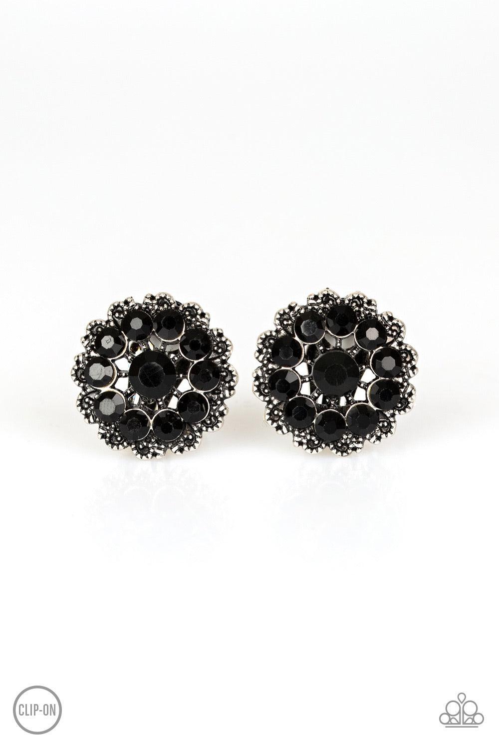 Paparazzi Accessories Business Bedazzle - Black *Clip-On Dotted silver filigree spins around a black rhinestone encrusted center, swirling into a refined floral frame. Earring attaches to a standard clip-on fitting. Sold as one pair of clip-on earrings. J