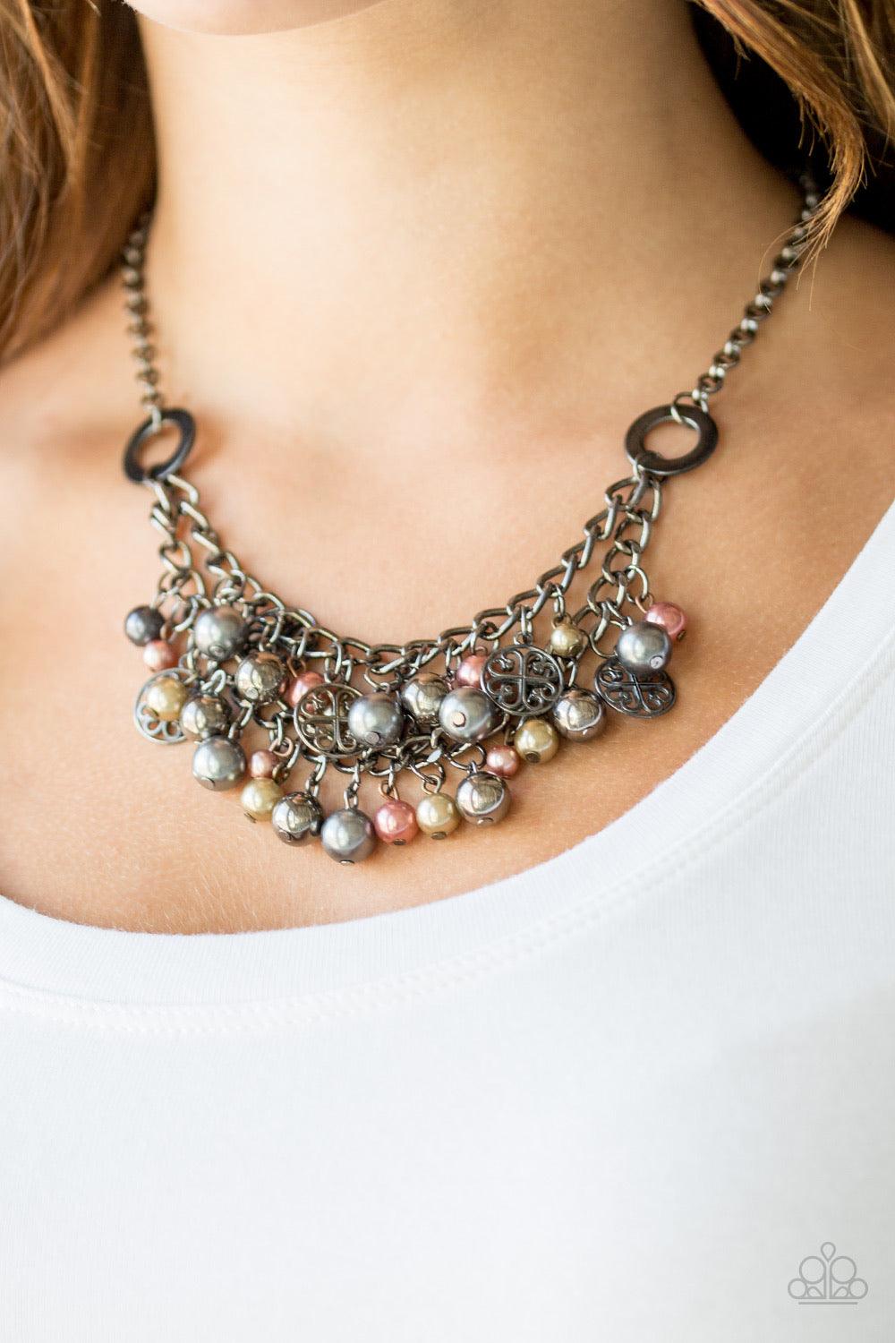 Paparazzi Accessories Cinderella Glam - Multi Brass, copper and gunmetal pearls, and shimmery gunmetal accents swing from the bottom of interlocking gunmetal chains, creating a bold fringe below the collar for a glamorous look. Features an adjustable clas