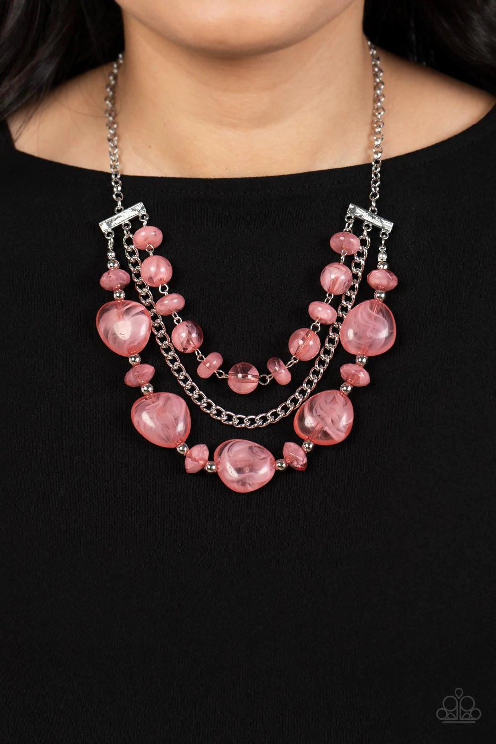 Paparazzi Accessories Oceanside Service - Pink A single silver chain separates two mismatched rows of oversized and cloudy glass-like pink beads. The colorful rows are held in place with textured silver fittings, creating an ethereal pop of color below th