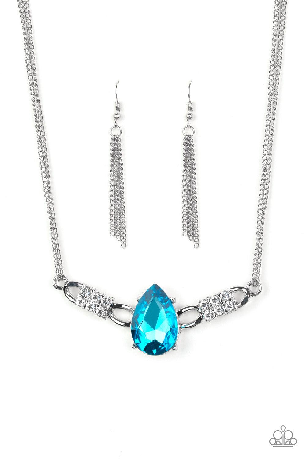 Paparazzi Accessories Way to Make An Entrance ~Blue Cut into an alluring teardrop, an oversized blue rhinestone gem attaches to bold silver frames radiating with glassy white rhinestones. The dramatic pendant attaches to doubled silver chains, swinging ho