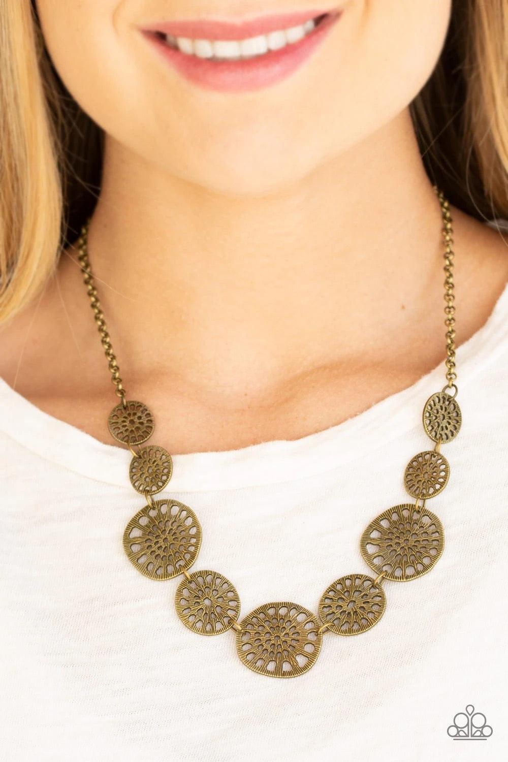 Paparazzi Accessories Your Own Free WHEEL - Brass Featuring airy stenciled patterns, shimmery brass discs link below the collar for a whimsical asymmetrical look. Features an adjustable clasp closure. Jewelry