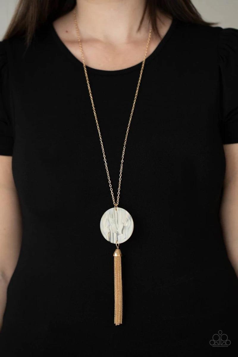 Paparazzi Accessories Up FAUX Grabs - White A dramatic gold chain tassel swings from the bottom of an oversized shell-like acrylic disc, creating a fabulously stacked pendant at the bottom of a lengthened gold chain. Features an adjustable clasp closure.