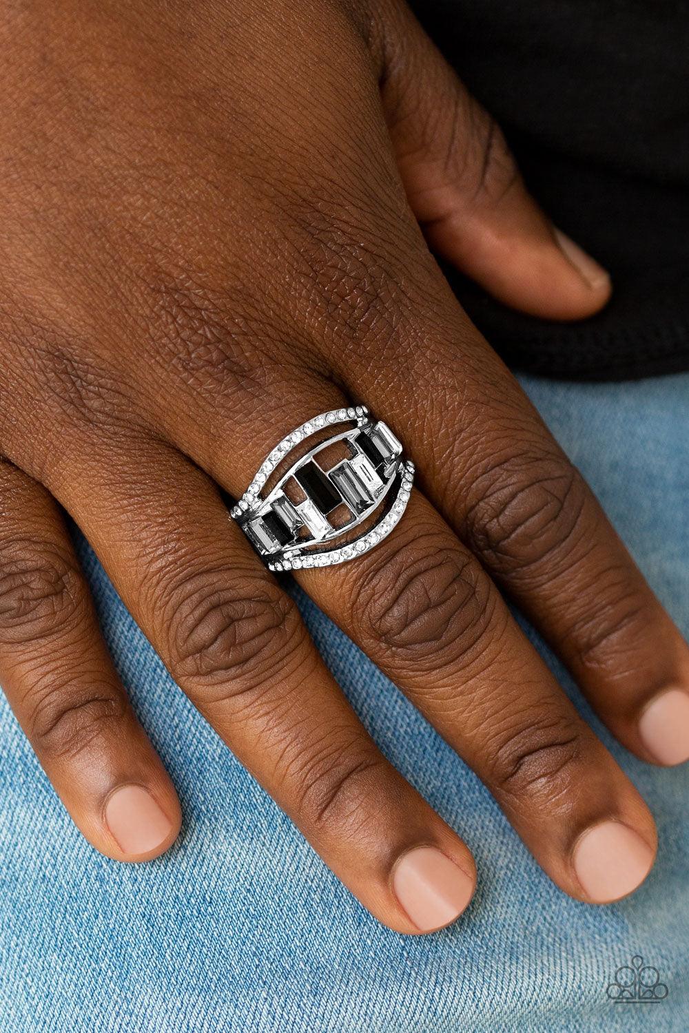 Paparazzi Accessories Treasure Chest Charm - Black White rhinestone encrusted bands flank a row of emerald cut glass beads in shades of black, gray, and white for a regal look. Features a stretchy band for a flexible fit. Sold as one individual ring. Jewe
