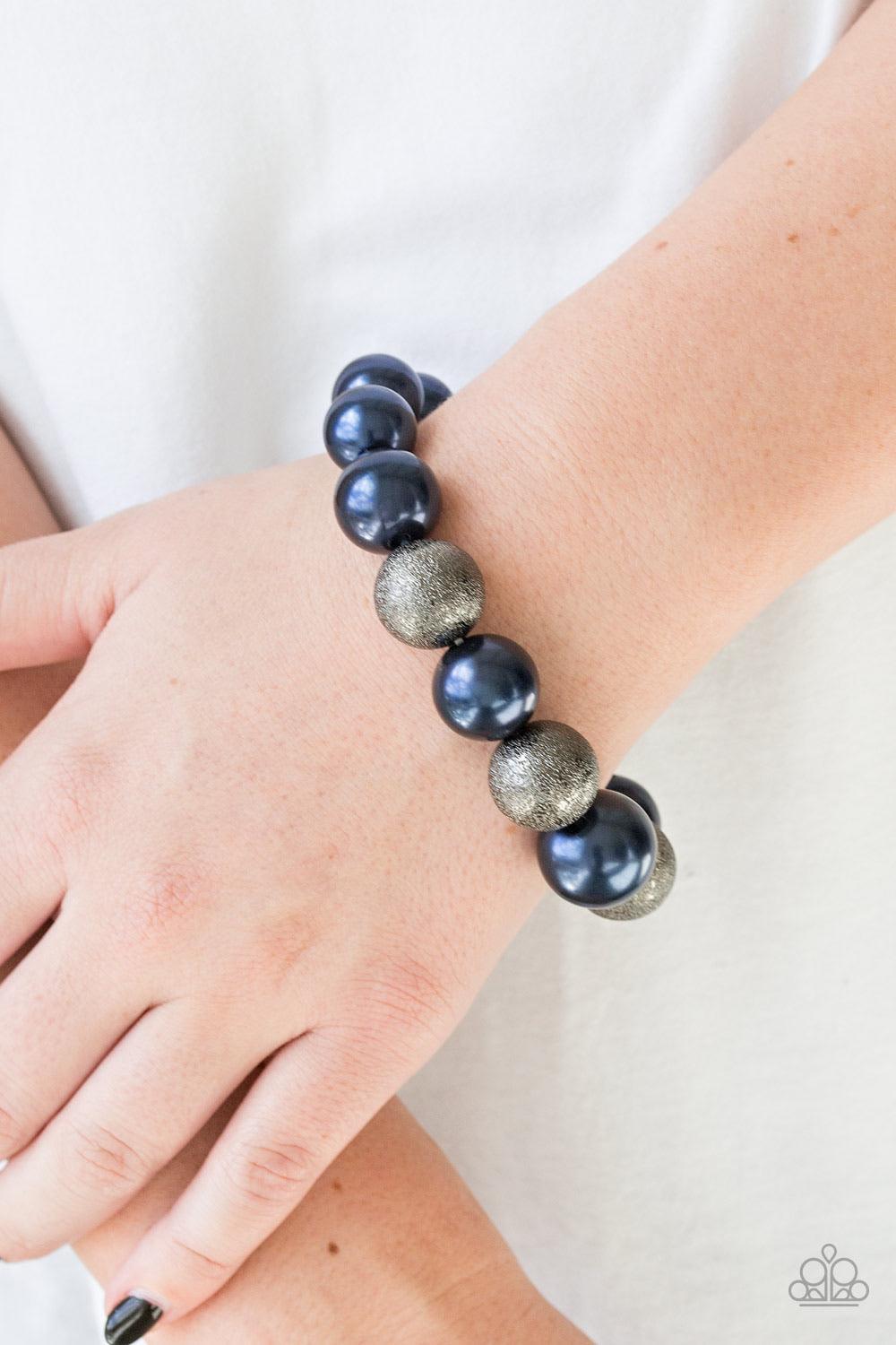 Paparazzi Accessories Humble Hustle - Blue Dusted in glitter, sparkling gunmetal and pearly blue beads are threaded along a stretchy band around the wrist for a glamorous look. Sold as one individual bracelet. Jewelry